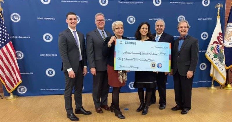 Taskforce Grant Recipients Holding a Large Check